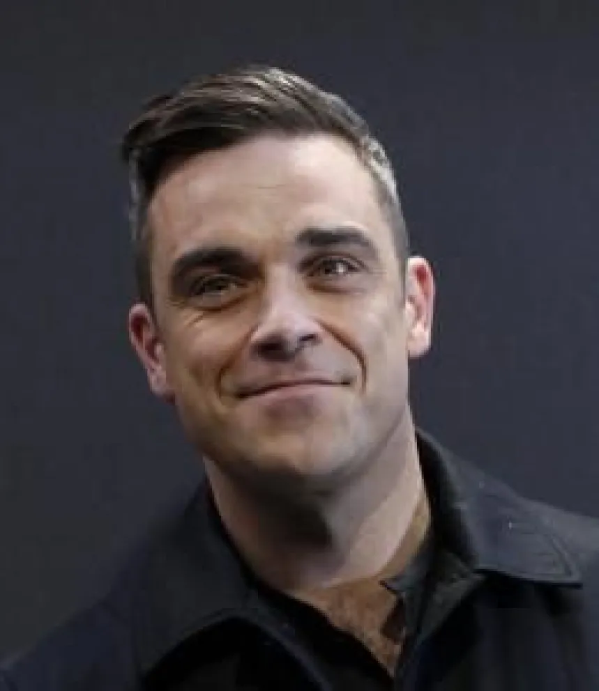 Cantante Robbie Williams anuncia que será padre